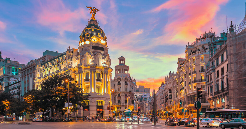 International city street with a statue on top of a building