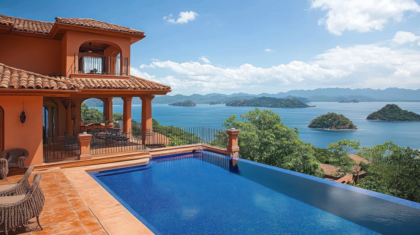 high end home with a pool with a large body of water in the background